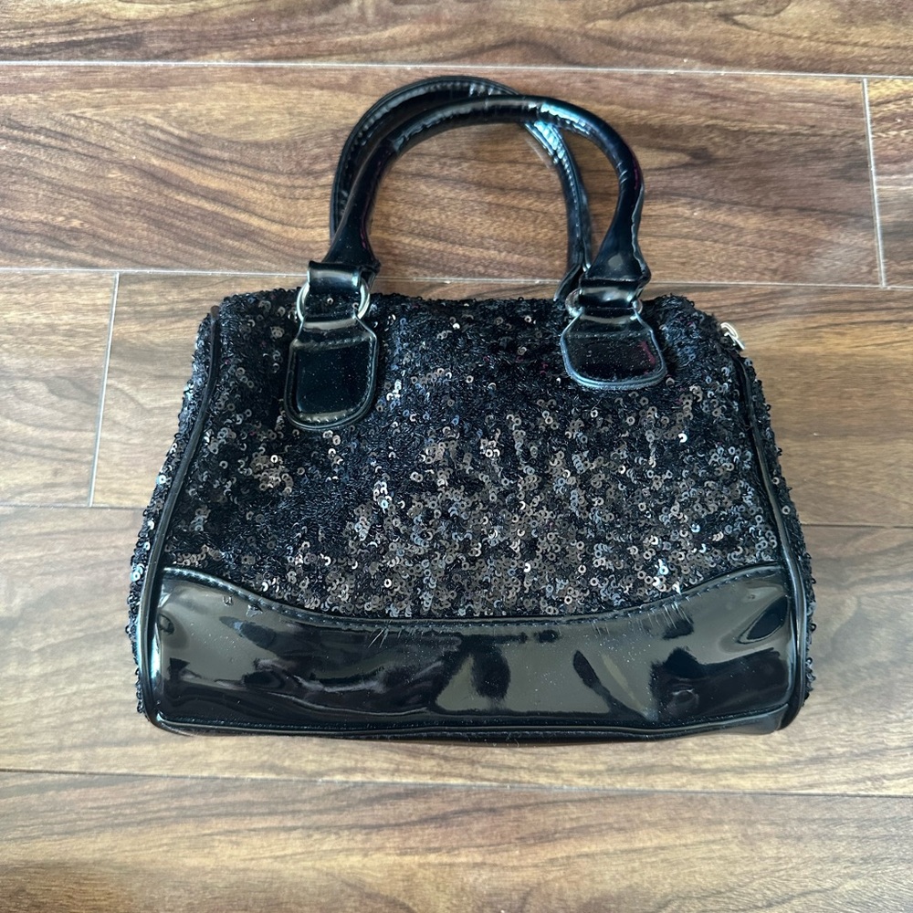 Black sequin and patent leather handbag